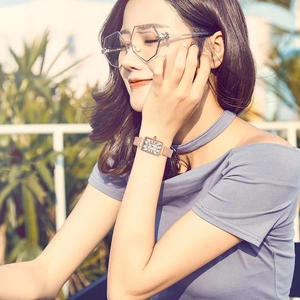 Elegant rose gold square watch for women with Roman numerals and mesh band on model