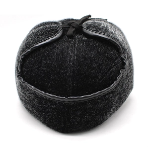 Close-up of thick faux mink fur and ear flaps on a men's winter thermal trapper hat