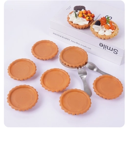 Realistic PVC egg tart shell models with decorative fruit toppings and mini tableware
