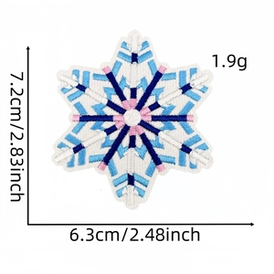 Detail view of snowflake embroidery patch showing dimensions 7.2x6.3cm on white background