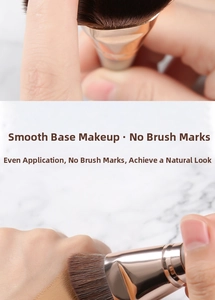 Flat foundation brush applying liquid makeup for a seamless and streak-free finish