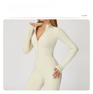 Detail view of beige yoga bodysuit featuring long sleeves with thumbholes and half-zipper