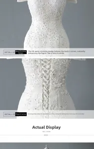 Détail de la robe de mariée blanche avec broderie en dentelle et laçage au dos ajustable