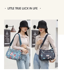 Detail of printed nylon shoulder bag with multiple zippered pockets and adjustable strap