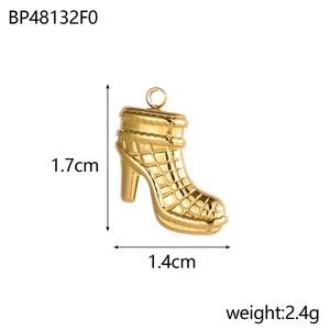 Macro view of gold high heel boot pendant with quilted texture and dimension details