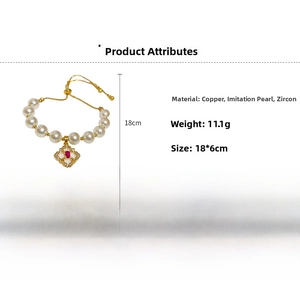 Detailed view of the zircon diamond pendant and white imitation pearl bracelet clasp