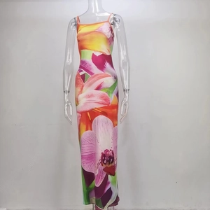 Detail of floral print maxi dress featuring thin straps and backless high slit design