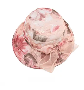 Top view of floral sun hat for women with pink roses and organza bow detail