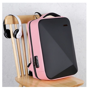 Detail of pink and black hard shell anti-theft backpack with side combination lock