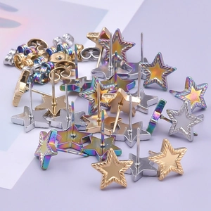 Detail of star-shaped stainless steel stud earrings in silver, gold and rainbow finishes