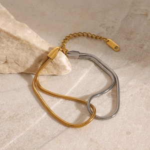 Two-tone stainless steel snake bone bracelet in gold and silver finish with lobster clasp