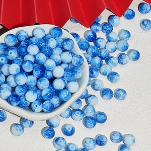 Blue and white porcelain style resin beads for DIY jewelry making in a white bowl