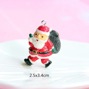 Detailed view of resin Santa pendant with glitter finish and size 2.5x3.4cm marking