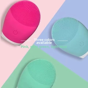 Detailed view of silicone facial cleansing brushes in pink, light green, and light blue