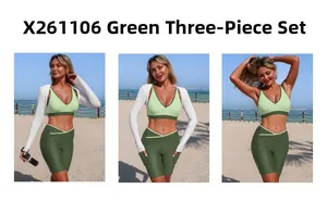 Outdoor beach view of three-piece set with green sports bra, shorts and white cover-up