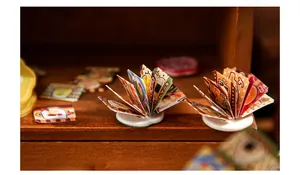 Macro detail of miniature Japanese food menus and stickers on white round bases