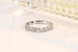 Detailed view of geometric silver rings featuring pavé zircon triangles and open design