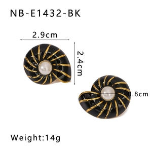 Detail of black shell earrings with gold trim, white pearl center and 2.9cm size specs