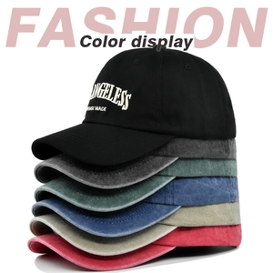 Detailed stack of multi-color vintage washed cotton baseball caps with high-quality embroidery