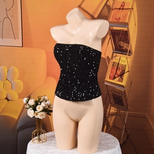 Detail shot of a black sequined tube top with shiny reflective texture on a mannequin
