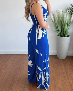 Detail of royal blue floral jumpsuit showing back view with wide leg cut and waist design