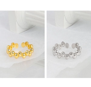 Close-up of S925 sterling silver oval bead rings in gold and silver finishes