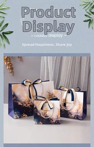 Three-piece royal blue marble gift bags with gold ribbons and sweet times text