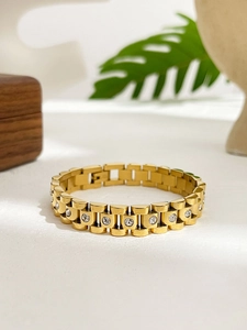 Detail of 18K gold plated titanium steel watchband bracelet with white cubic zirconia