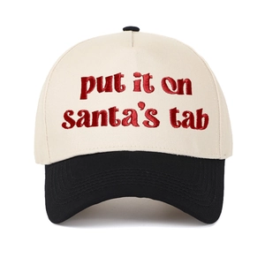 Two-tone baseball cap with Put It on Santa's Tab embroidery in beige and black