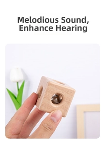 Macro shot of Montessori wooden rattle toy with built-in metal bell for sensory play