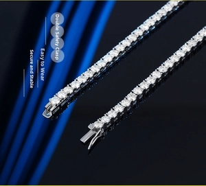 Macro shot of silver tennis chain featuring a secure double-safety clasp and moissanite