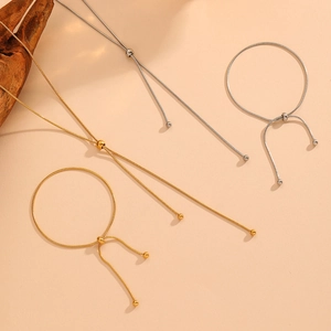 Adjustable snake chain jewelry set with ball tassels in gold and silver finish
