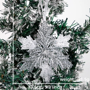 Detail of 13cm acrylic snowflake ornament with glitter on a snowy Christmas tree branch