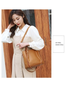 Detail of classic patterned tote bag with adjustable shoulder strap and sturdy handles