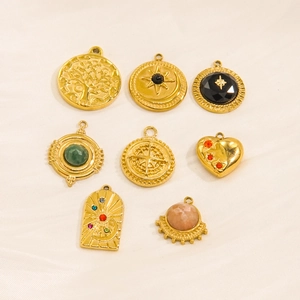Collection of vintage gold plated natural stone pendants featuring celestial and tree motifs
