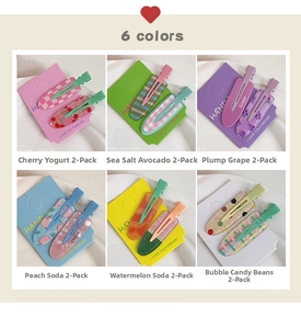 Detail showing set of six colorful acrylic hair clips with fruit and candy patterns