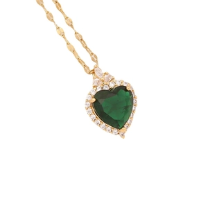 Gold stainless steel heart necklace with green stone and sparkling halo on white background