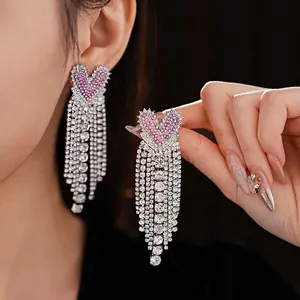 Pink heart tassel earrings featuring silver rhinestone fringes in a luxury style