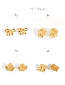 Macro display of four vintage 18K gold-plated geometric earrings with diverse textures