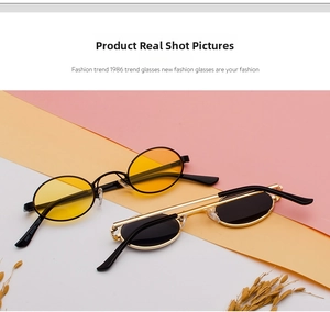 Macro shot of small oval vintage sunglasses with metal frames and colorful tinted lenses