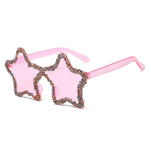 Pink star-shaped sunglasses with shimmering silver rhinestones on a white background