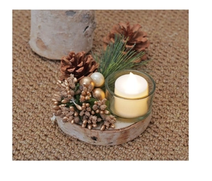 Close-up of a rustic Christmas candle holder with wood base, pine cones, and LED light