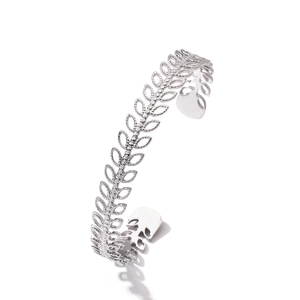 Close-up of hollow leaf design on silver stainless steel open bangle from 45-degree angle
