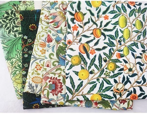 Detail of vintage William Morris floral and fruit patterns on premium canvas fabric