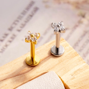 Titanium flower labret studs with crystal petals in gold and silver finishes