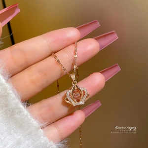 Elegant rose gold crown pendant necklace with sparkling zircons and a dancing center stone