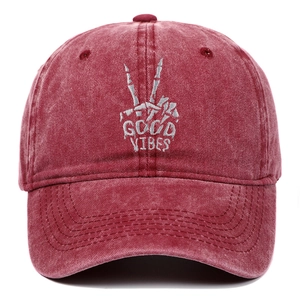 Vintage washed cotton baseball cap in wine red with Good Vibes skeleton hand embroidery