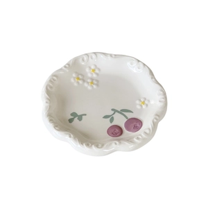 Ceramic dessert plate with wavy edges, white flower motifs and purple berries