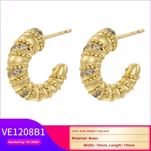 Detailed view of gold C-shape brass earrings with zircons and ribbed texture, 18x19mm size