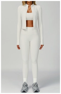 Three-piece white ribbed yoga set featuring zipper jacket, sports bra and leggings